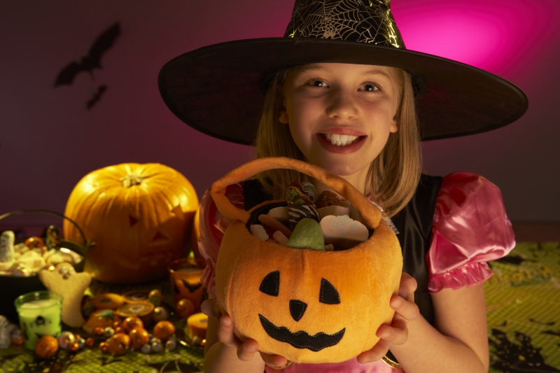 2193074-halloween-party-with-a-child-showing-candy